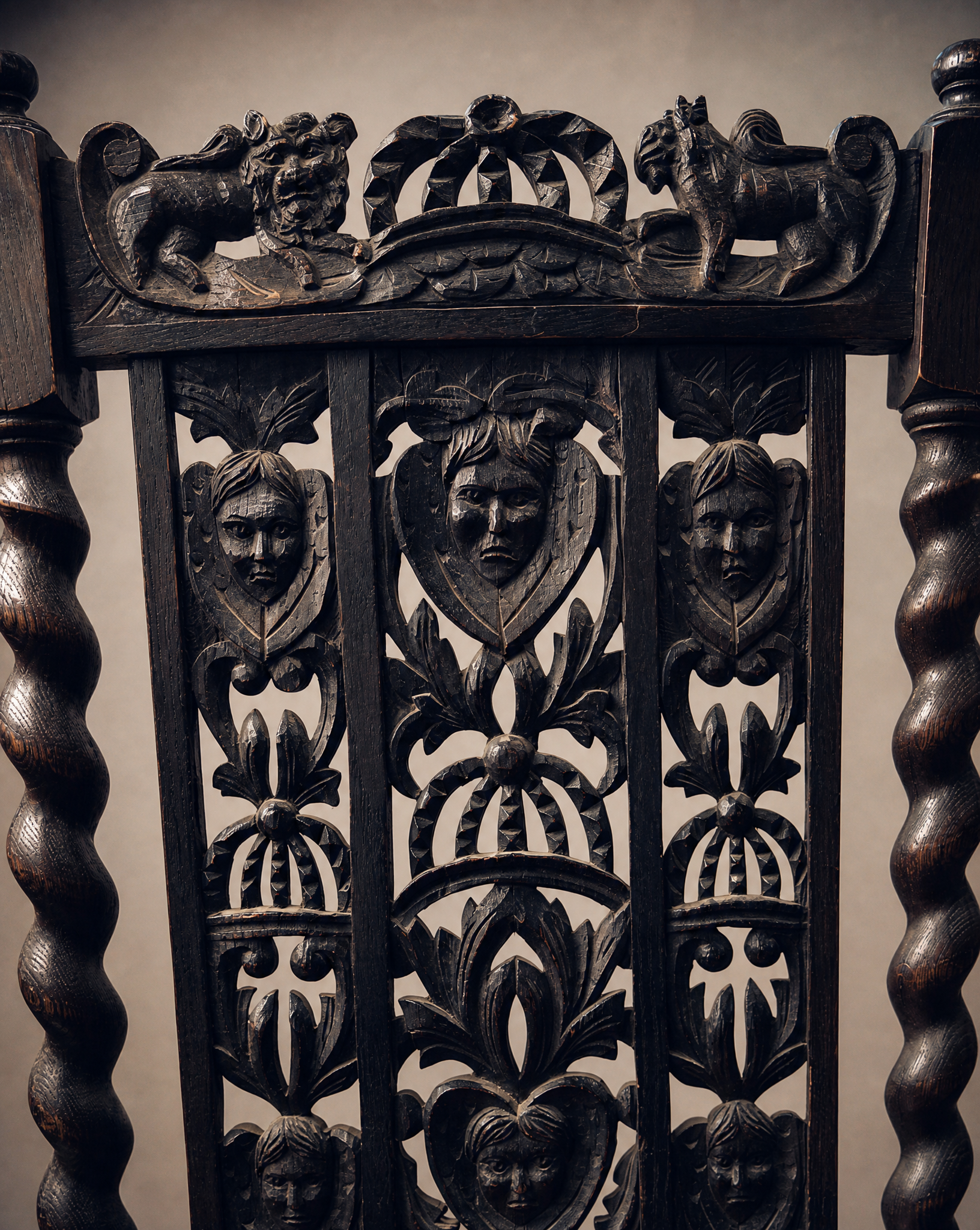 Pair of Antique Jacobean Revival Carved Oak Hall Chairs with Heraldic Crest Backs & Leather Seats
