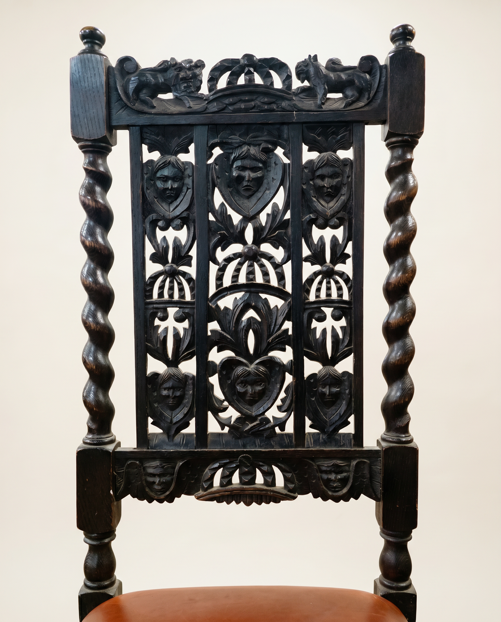 Pair of Antique Jacobean Revival Carved Oak Hall Chairs with Heraldic Crest Backs & Leather Seats