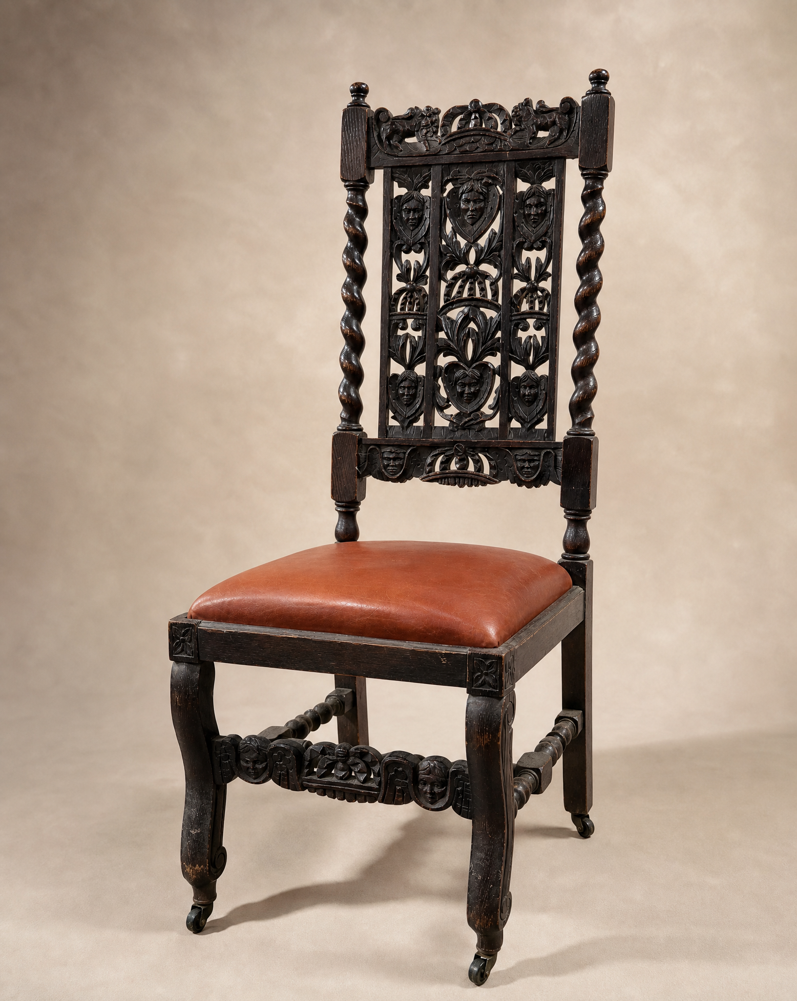 Pair of Antique Jacobean Revival Carved Oak Hall Chairs with Heraldic Crest Backs & Leather Seats