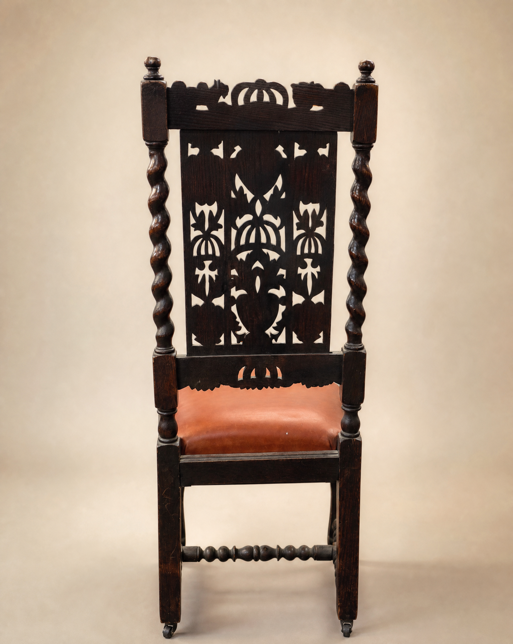 Pair of Antique Jacobean Revival Carved Oak Hall Chairs with Heraldic Crest Backs & Leather Seats