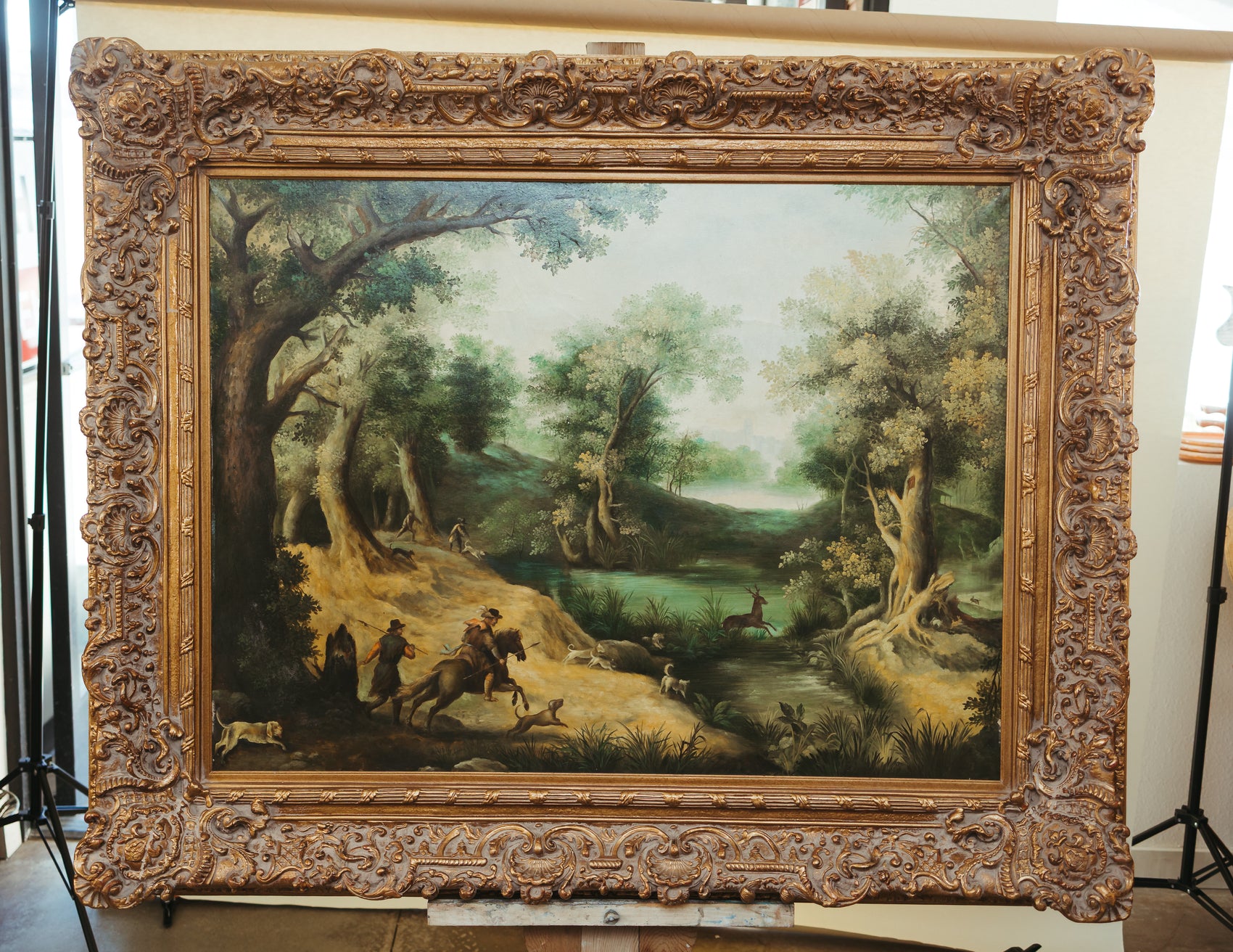 Antique-Style Framed Landscape Oil Painting with Hunting Scene.