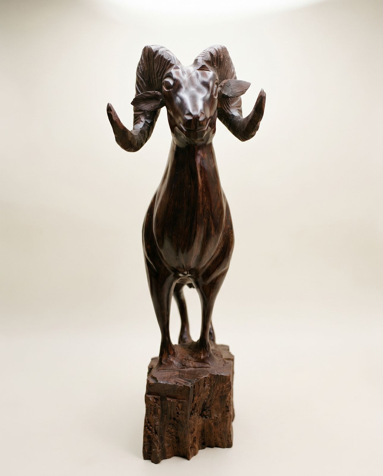 Hand-Carved Ram Sculpture on Natural Wood Base