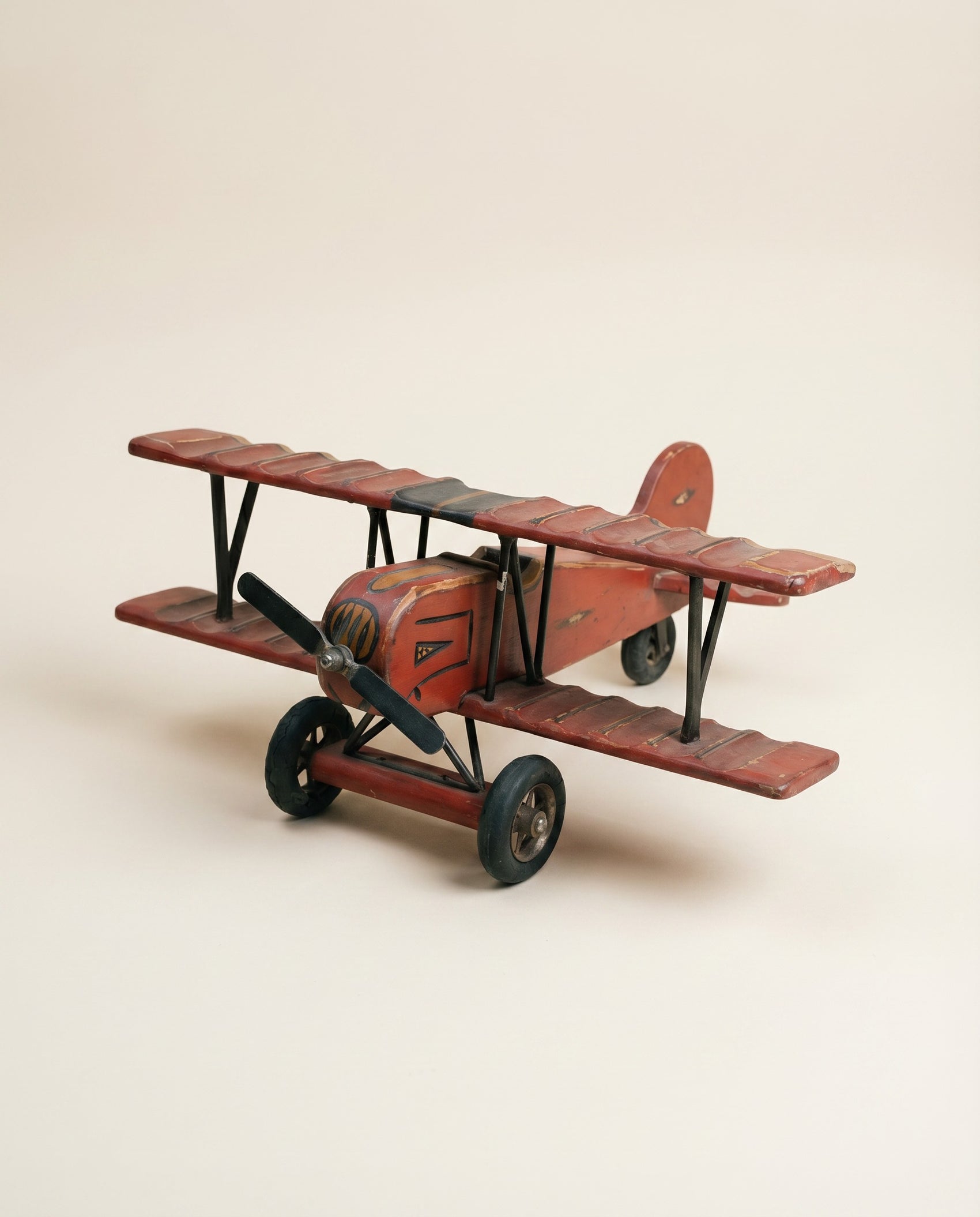 Vintage Hand-Painted Wooden Biplane Toy with Rolling Wheels