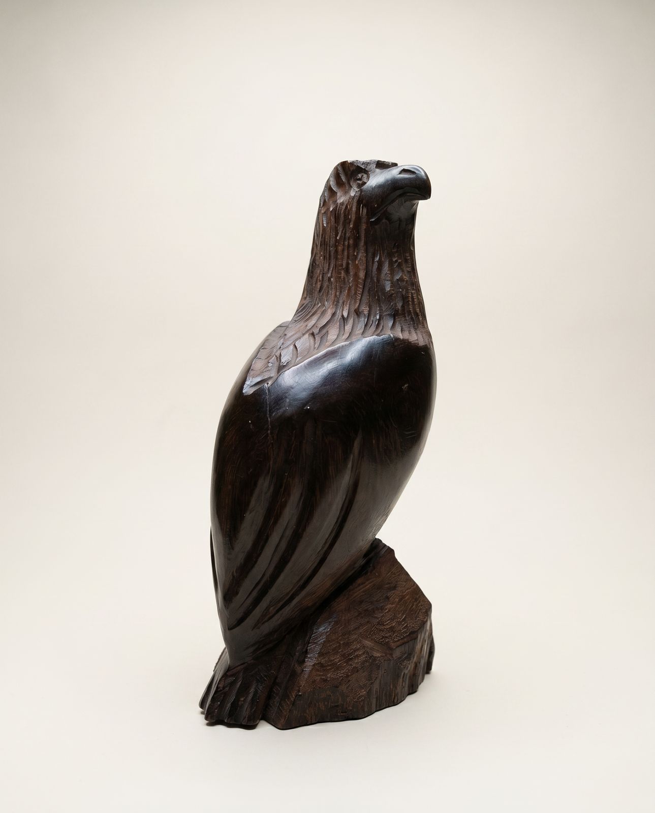 Hand-Carved Wooden Eagle Sculpture on Natural Wood Base