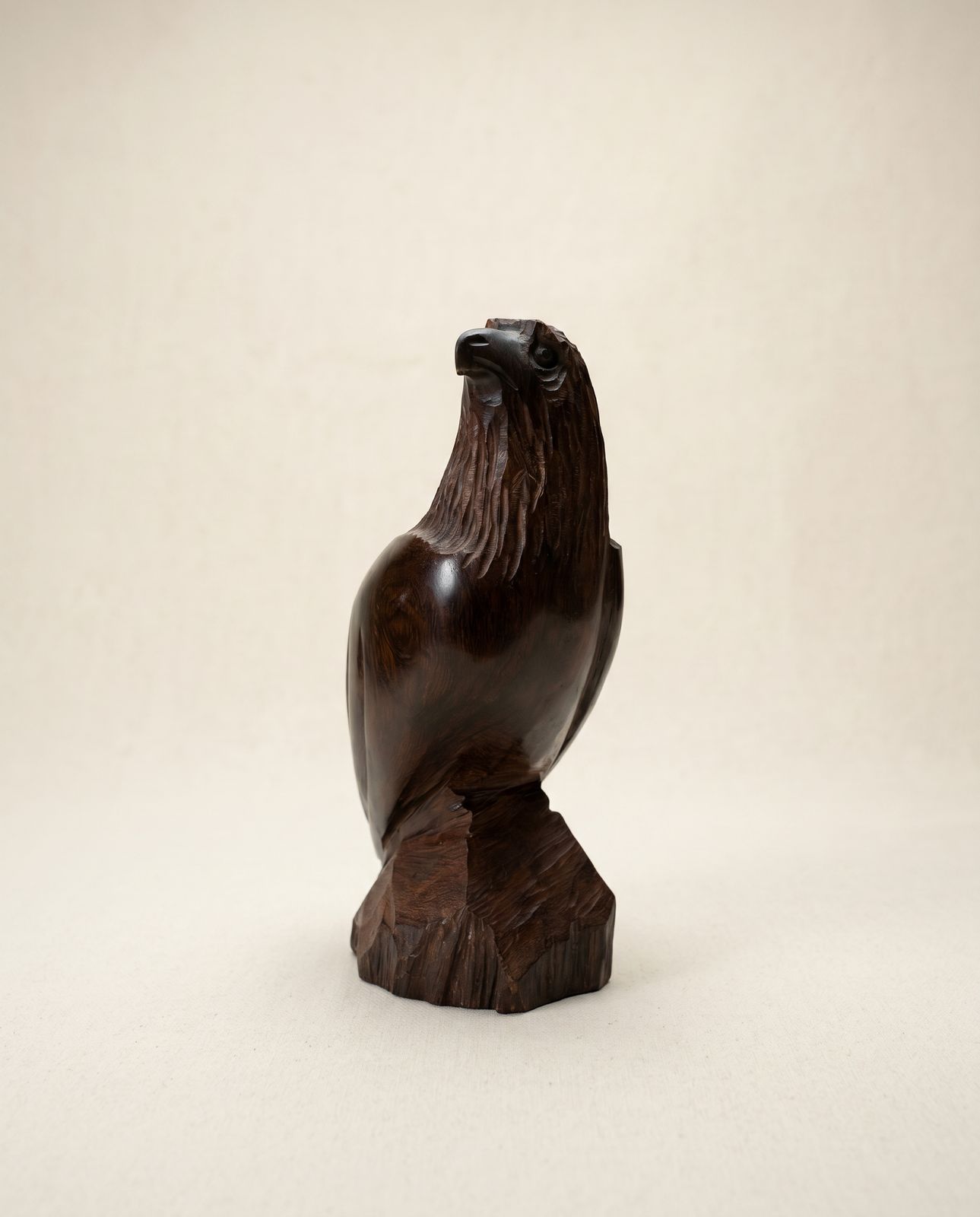 Hand-Carved Wooden Eagle Sculpture on Natural Wood Base