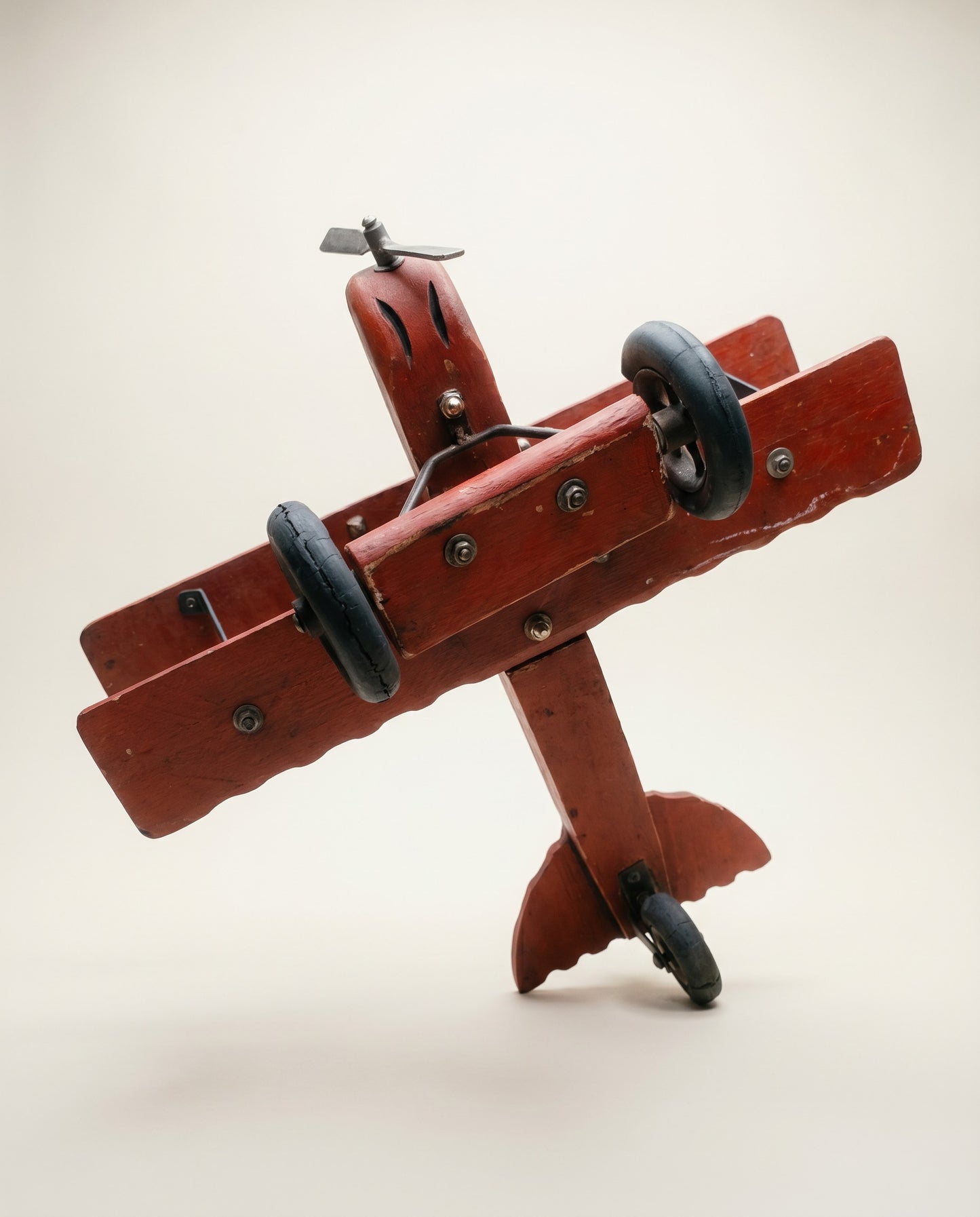 Vintage Hand-Painted Wooden Biplane Toy with Rolling Wheels