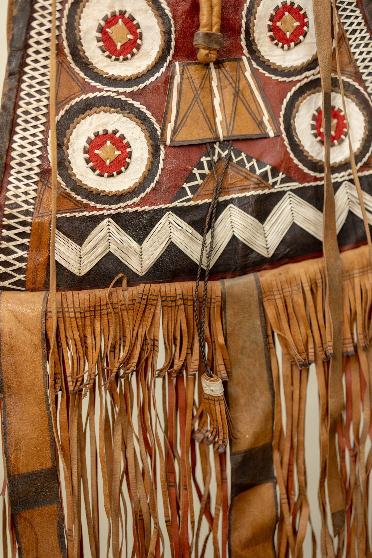 Handcrafted Leather Tribal Fringe Bag with Geometric Embroidery